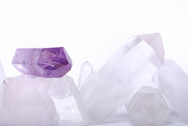 Amethyst energized on quartz Amethyst energized on quartz crystals -  semiprecious gems are used for jewels and also in esoteric and alternative medicine la geode stock pictures, royalty-free photos & images