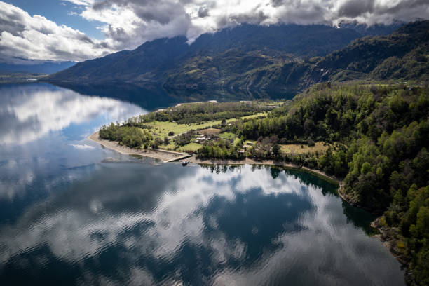 istock Lake surrounded by forests on a cloudy day 1467378055