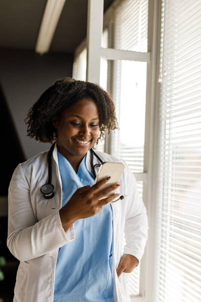 istock Young female doctor taking a break from seeing patients and responding to text messages 1467378123