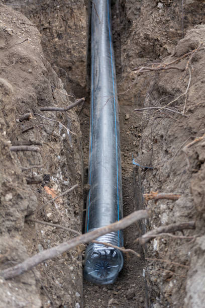 istock Plumbing industrial pipe laying. Industrial plastic polypropylene pipe. Sanitary, sewer drainage system for a multi-story building. Civil infrastructure pipe, water lines and storm sewers 1467378238