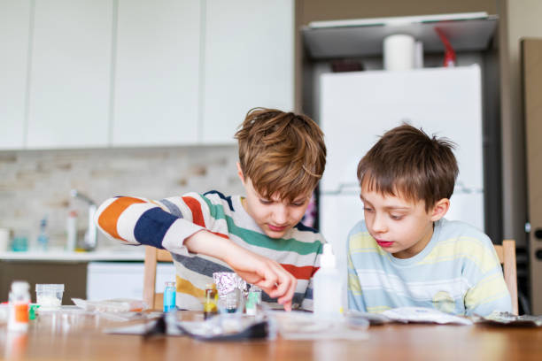 istock Two boys making science chemical experiment at home 1467379770