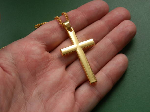 istock Religious metal symbol medallion in hand 1467385790