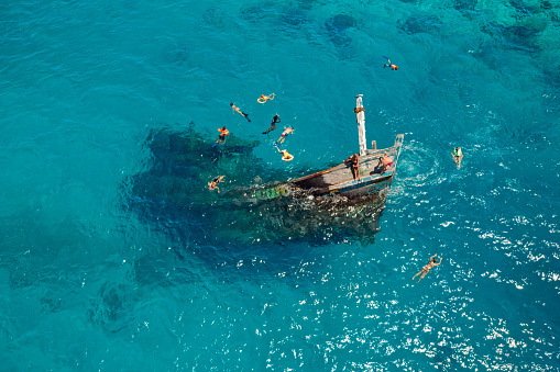 Aerial view of a sunken ship near Keyodhoo, Vaavu Atoll, Maldives, Indian Ocean. A place for tourists engaged in diving and snorkeling