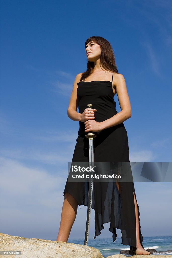 Sword Lady Attractive female model holding a samurai sword Adult Stock Photo