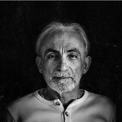 Close-up black and white portrait of a bearded man. Happy boss. Isolated on white background