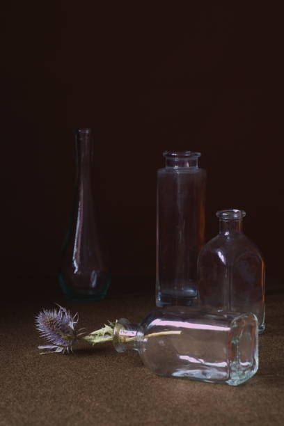 istock Background with blue thistl and bottles of different sizes 1467395682