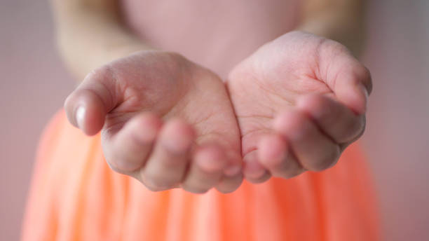 istock Girl holding out empty hands and waiting 1467396544