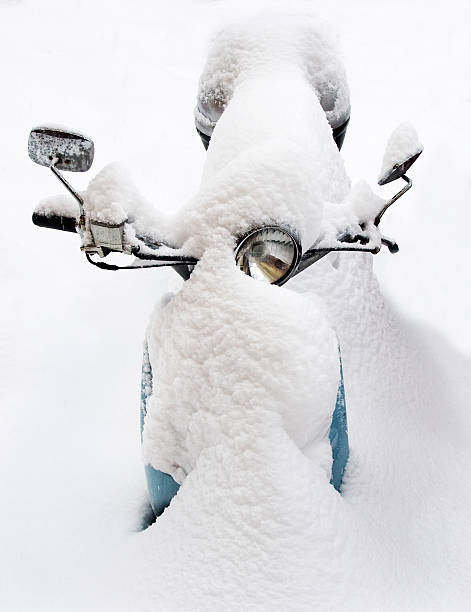 istock Snow covered blue vespa scooter 146740330