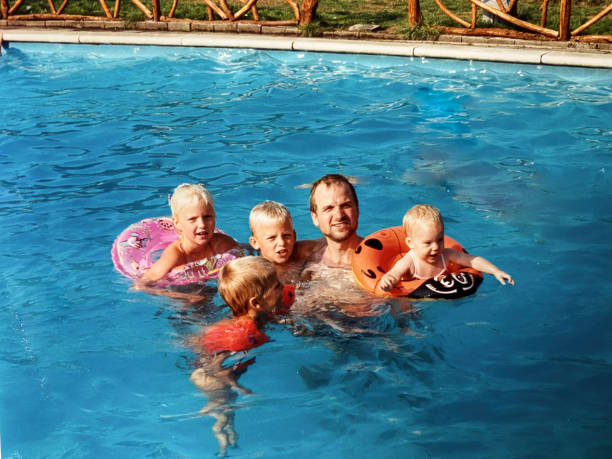 Family with four kids on vacation in the eighties