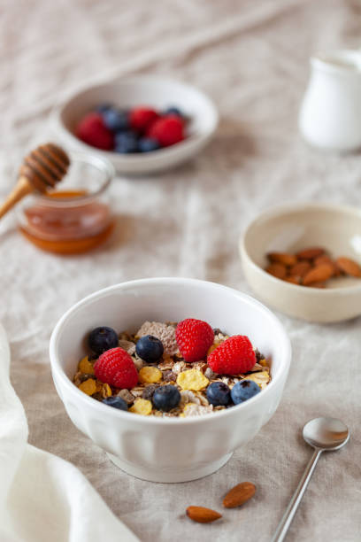 istock Oat flakes breakfast portion with raspberries, blueberries and honey 1467405819