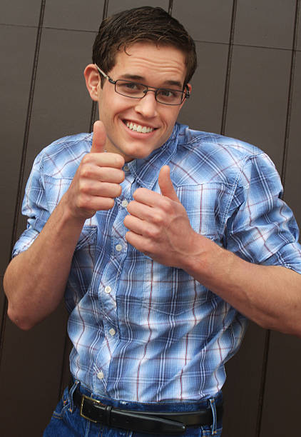 Nerd giving 2 thumbs up stock photo