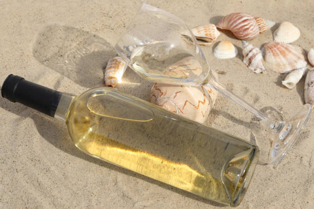 istock Glass of wine on the sand 1467407216