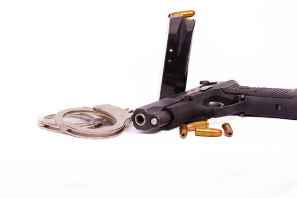 istock Gun, clip, bullets and handcuffs with copy space 1467410078