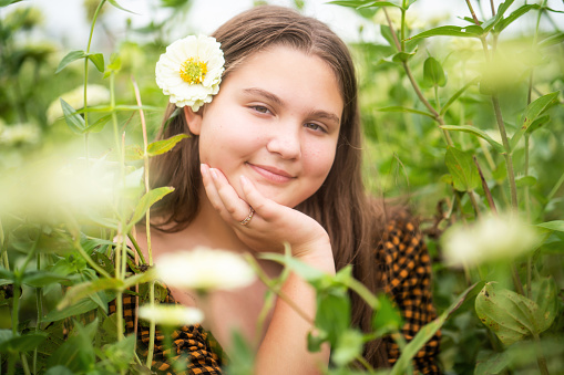 Latin girl on sunflower field
