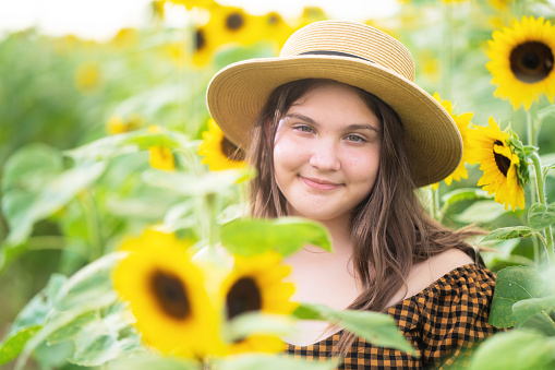 Cuban girl among sunflowers