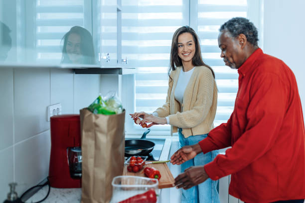 1,700+ Carer Helping With Groceries Stock Photos, Pictures & Royalty