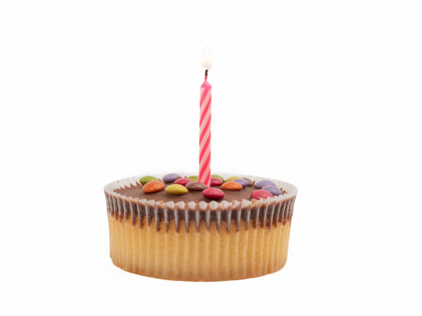 istock Muffin with a candle on a white background. Holiday muffin. 1467414672