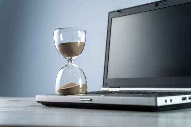 istock Laptop and hourglass 1467416531