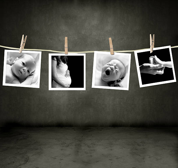 Pictures of a newborn and mother Pictures of a newborn and mother in a darkroom darkroom photos stock pictures, royalty-free photos & images