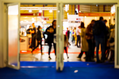 Entrance to Exhibition. Blurred Shot Of People Walking Indoors At Food And Food Technology Exhibition, Riga, Latvia. High quality photo