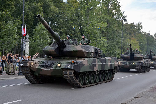 Warsaw, Poland - 15th August, 2014: German tanks Leopard driving on a parade during the Polish Armed Forces Day. Today is a popular tank in Polish army.