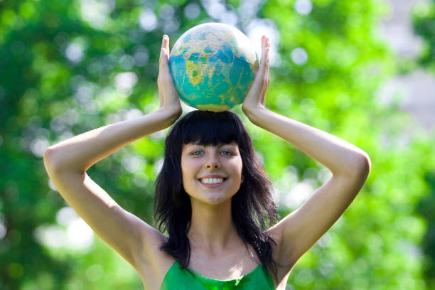 woman with globe stock photo
