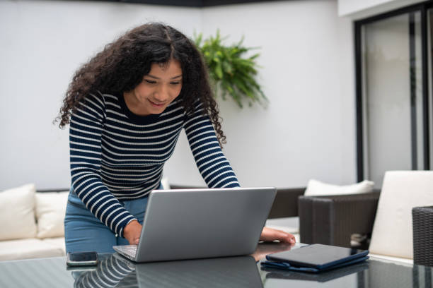 istock Woman is using her laptop to do internet shopping 1467425689