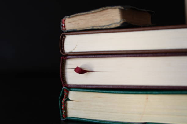 istock quran books stacked on a black background 1467427222