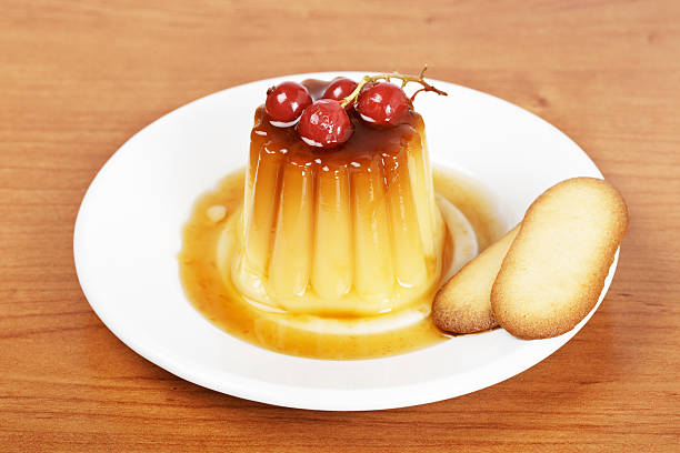 istock Cream caramel dessert with red currants and cakes 146742740