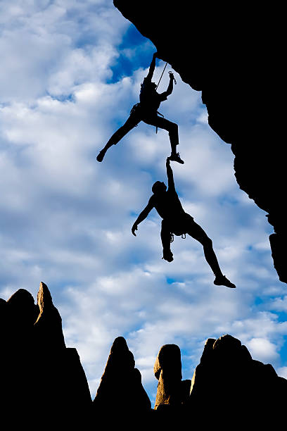 istock Team of climbers falling on the cliff 146742932