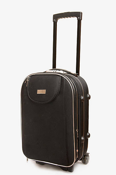istock Big black travel bag with hand isolated on white background 146743322