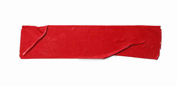 A piece of general purpose vinyl red tape isolated on white