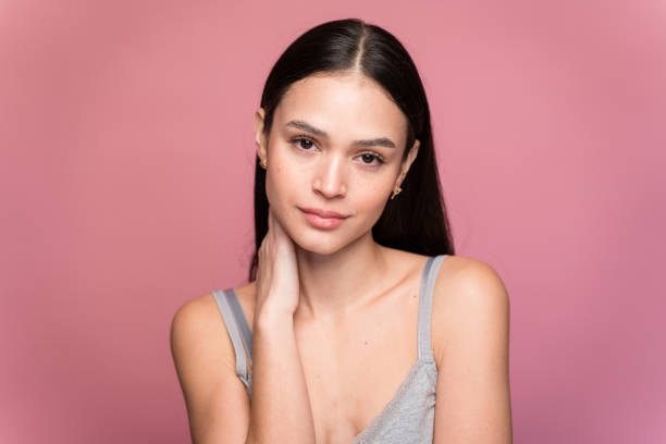 istock Young woman with makeup against pink background 1467436681