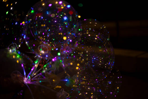 istock Colored balls in dark. LED Light. Transparent ball with colored lights. 1467436835