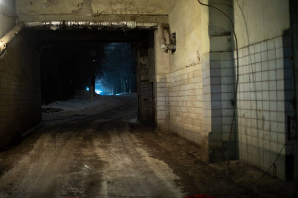 istock Entrance to industrial zone at night. Road through checkpoint. Exit to road. 1467437576