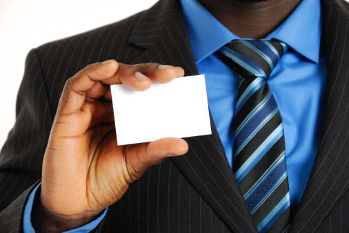 This is an image of a business man presenting a business card