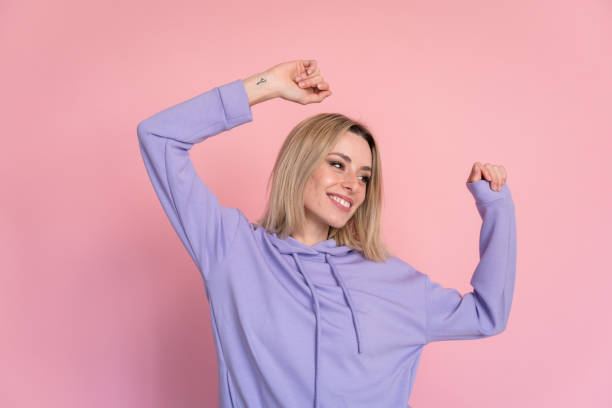 istock Cheerful young woman dancing in studio 1467439704