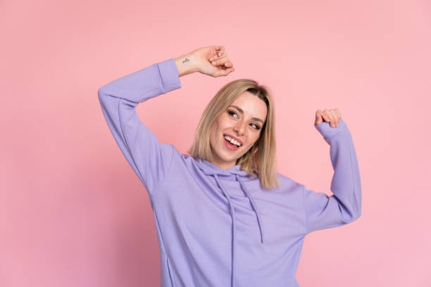 istock Cheerful young woman dancing in studio 1467439768