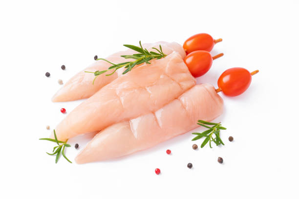 istock Raw chicken inner on skewers with tomatoes white background with spices, herbs.Raw uncooked Chicken meat,kebab on skewers.skewers raw meat and vegetables.Top view.Chicken Skewers breast fillet meat. 1467445477