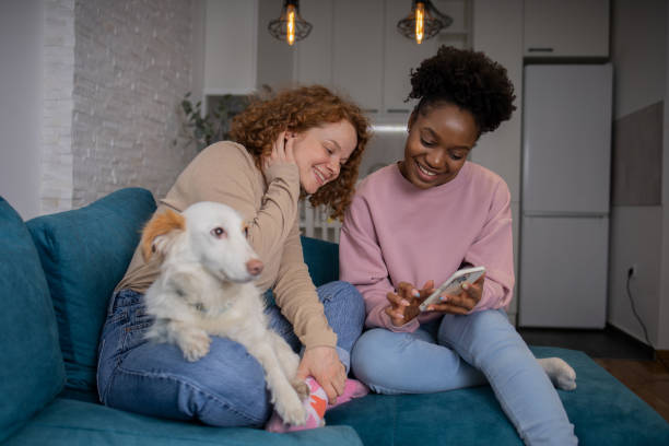 istock Two happy young women are chatting 1467449239