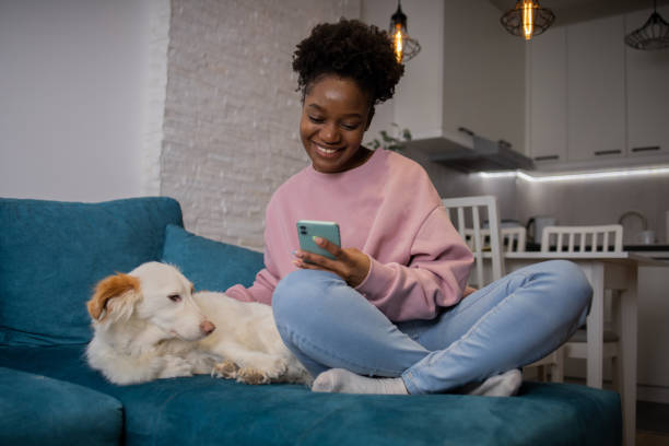 istock Happy young woman using phone 1467449639