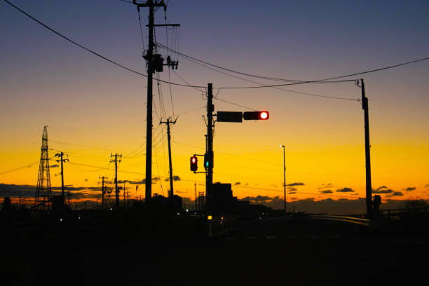 istock Traffic light and road before sunrise 1467451481