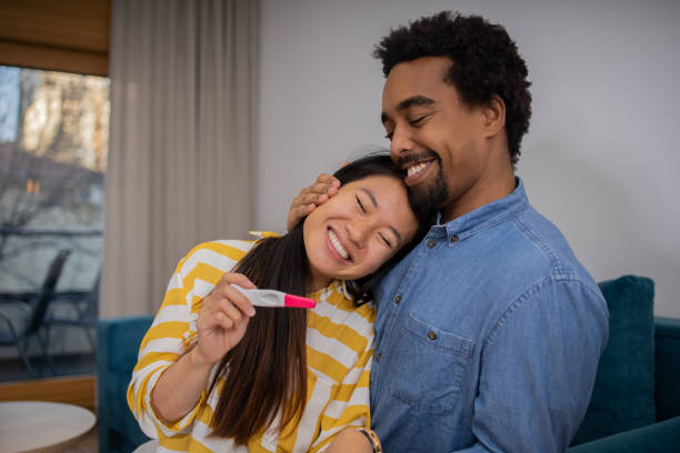 istock Woman holding pregnancy test 1467452165