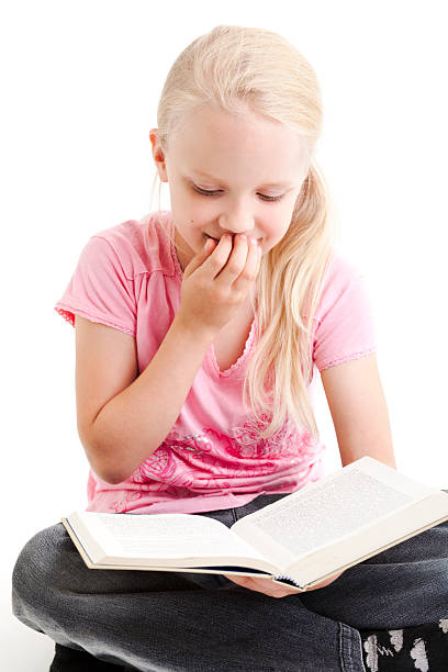 istock Young girl reading funny book 146745327