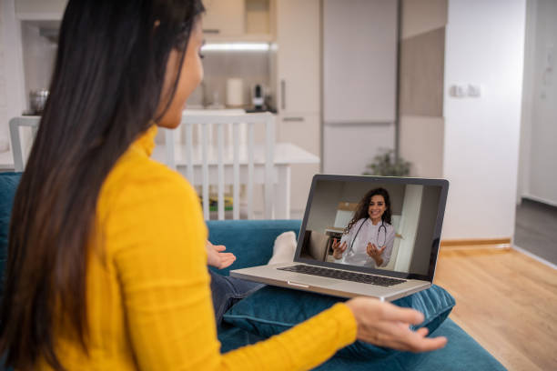 istock Young woman using laptop to talk to her doctor 1467453624