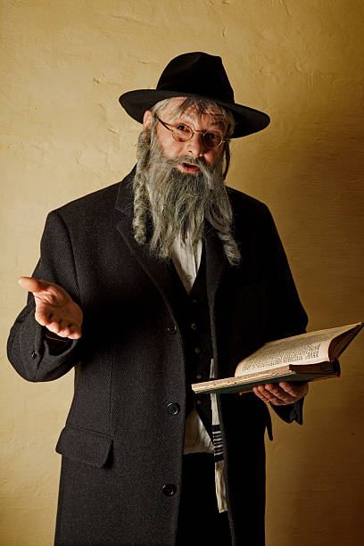 Old jew with book Old jewish man with grey beard holding a book hasidism photos stock pictures, royalty-free photos & images
