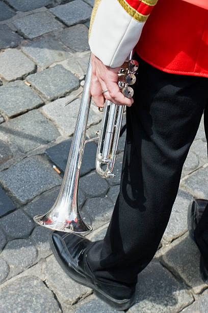istock man holding trumpet 146746026