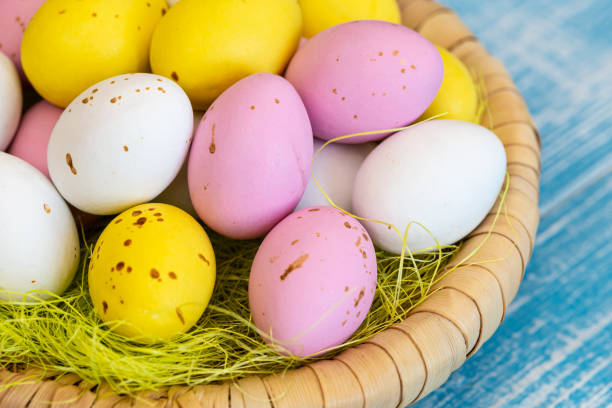 istock Easter candies, colorful chocolate eggs in a nest, close up. 1467460845