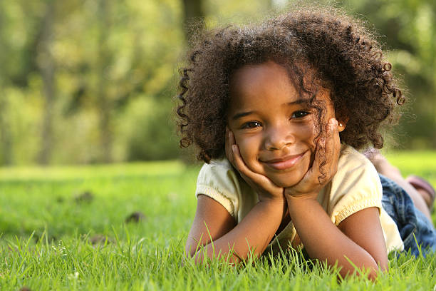 Happy Child Afro hairstyle little black girl hairstyle stock pictures, royalty-free photos & images