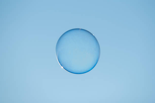istock Soap bubble floating against clear blue sky 1467463057